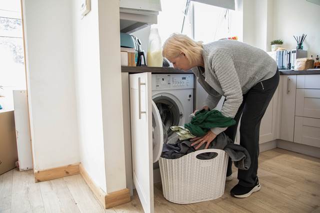 Person loading their washing machine