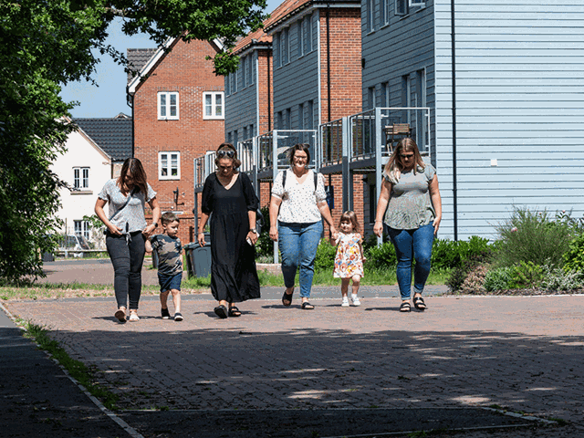 Family walking down a road