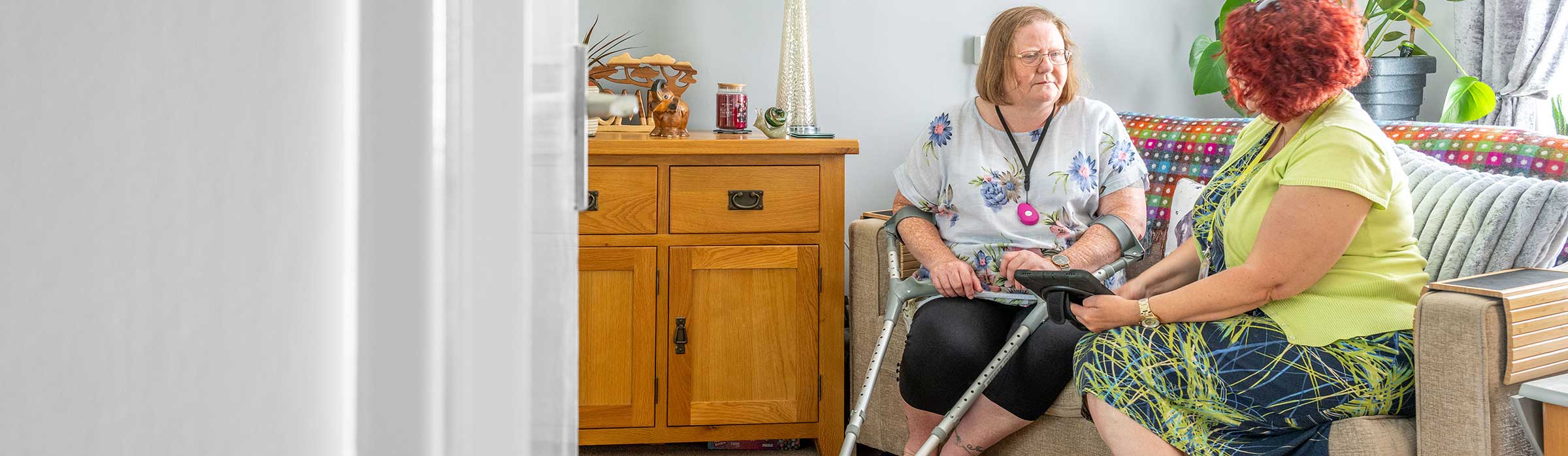 Housing officer visiting woman at home