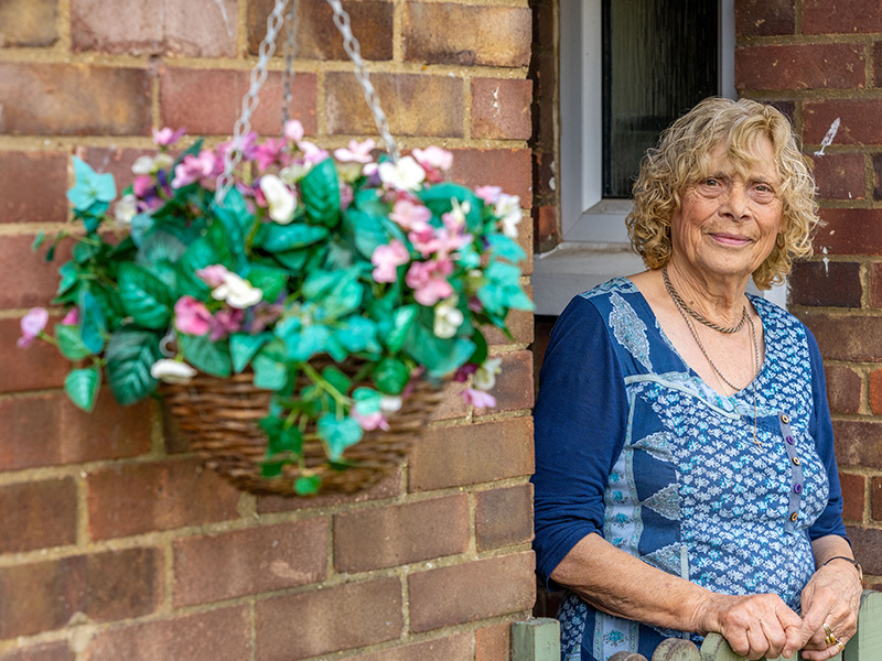 woman outside her home